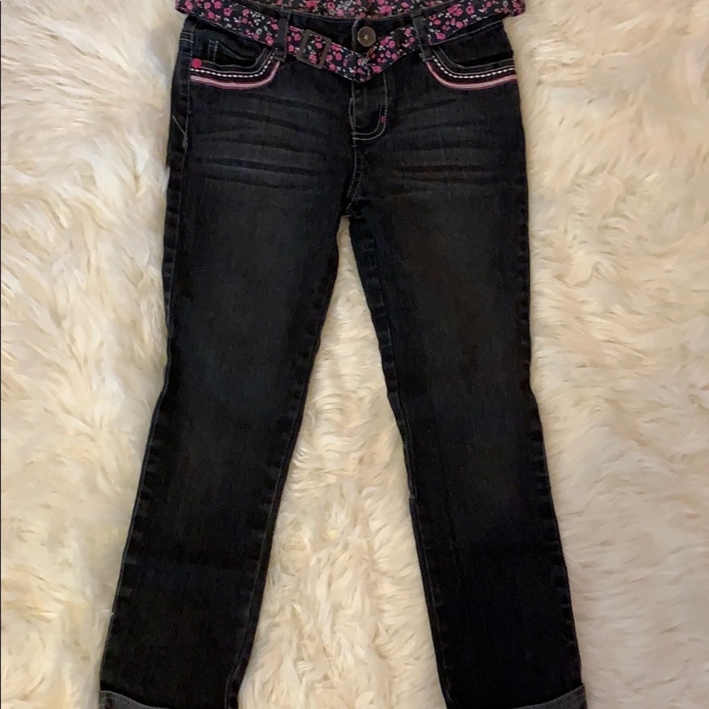 Dark wash jeans with a floral belt
